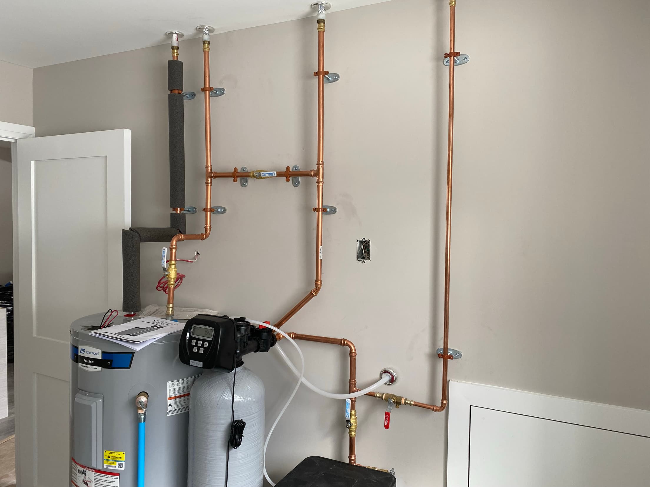 Copper supply lines, water softener and water heater installed by ARD Plumbing