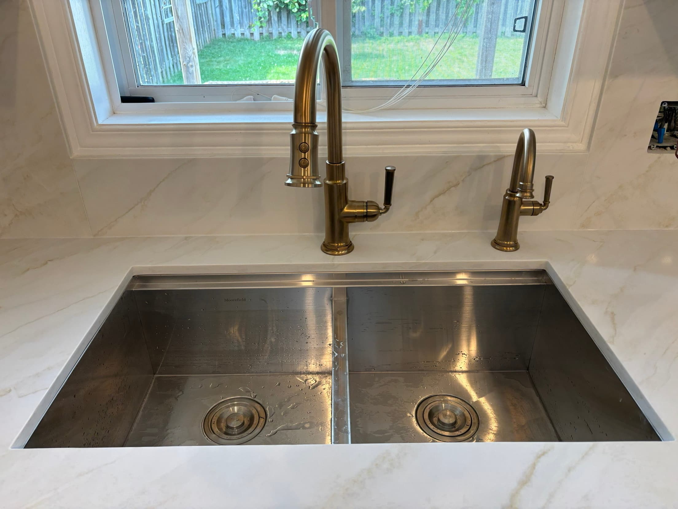 Finished kitchen sink and faucet installation by ARD Plumbing